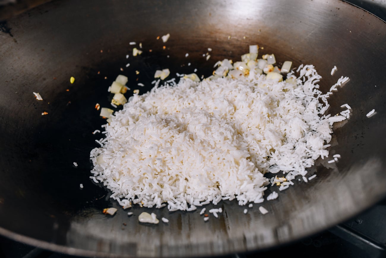 Adding rice to wok