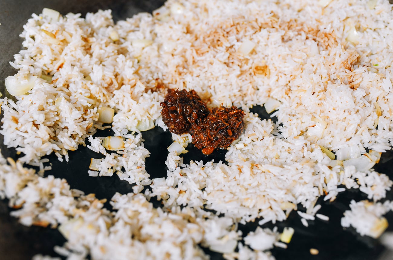 Adding XO Sauce to rice in wok