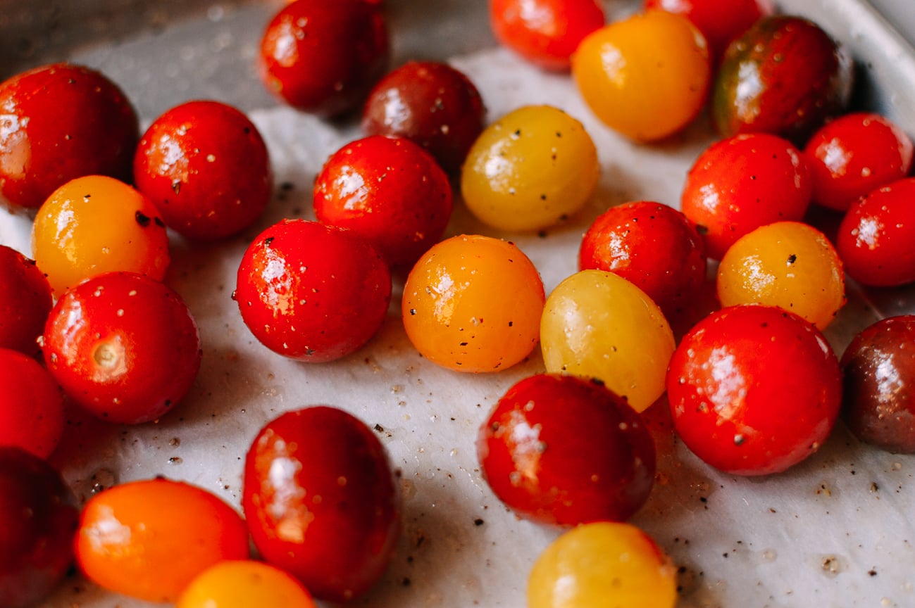 Cherry Tomatoes on parchment lined baking sheet