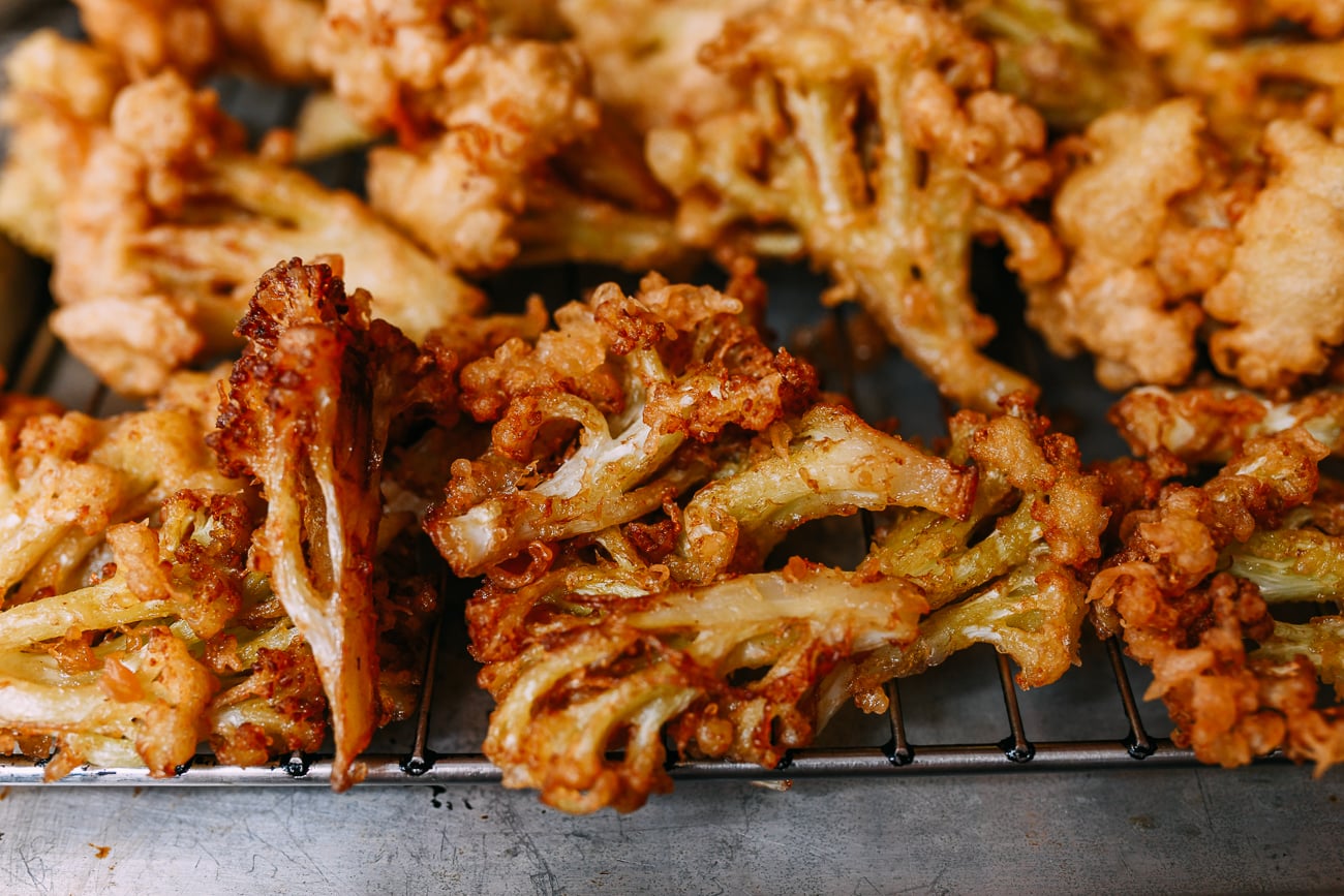Fried cauliflower draining on rack