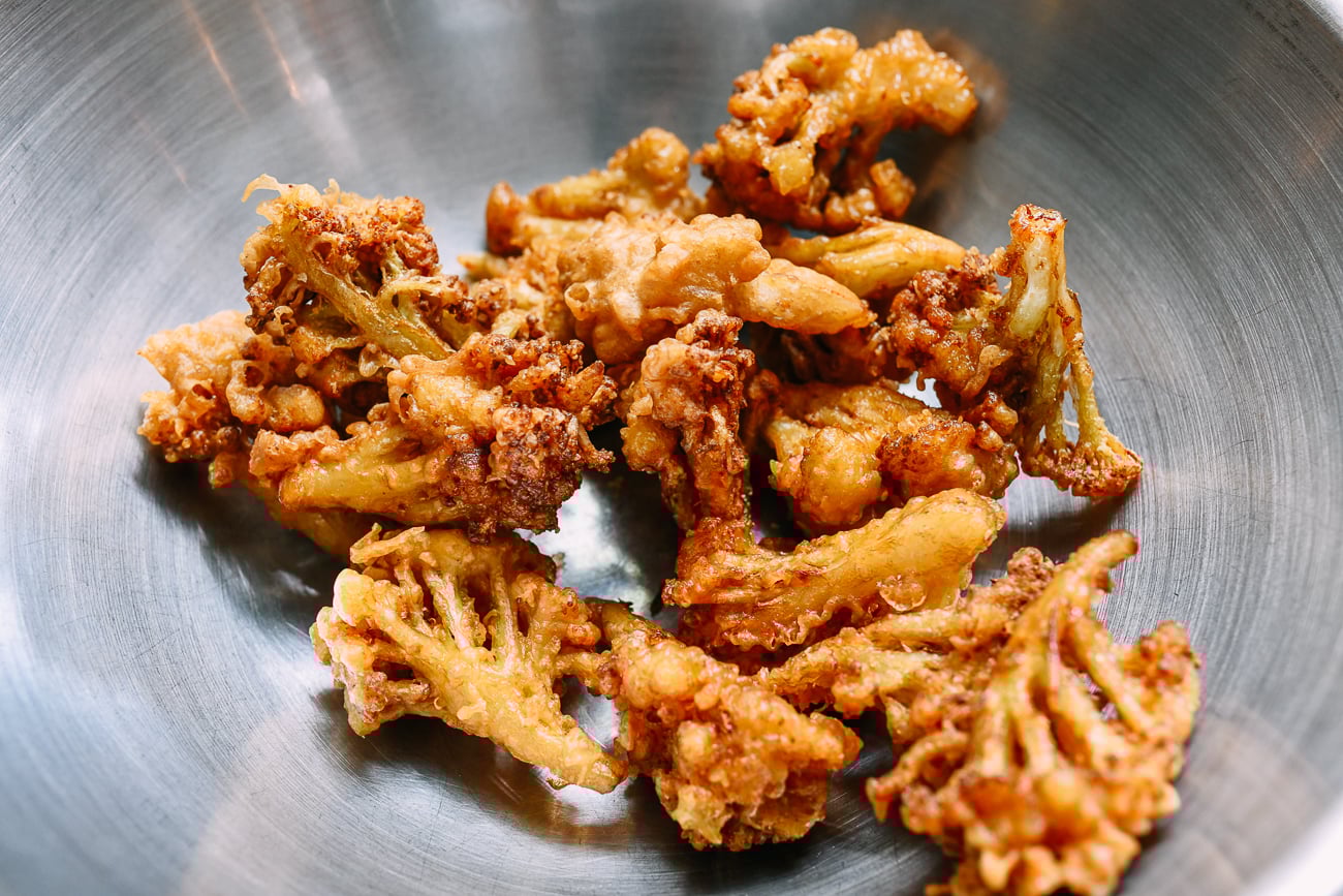 Fried cauliflower in metal bowl