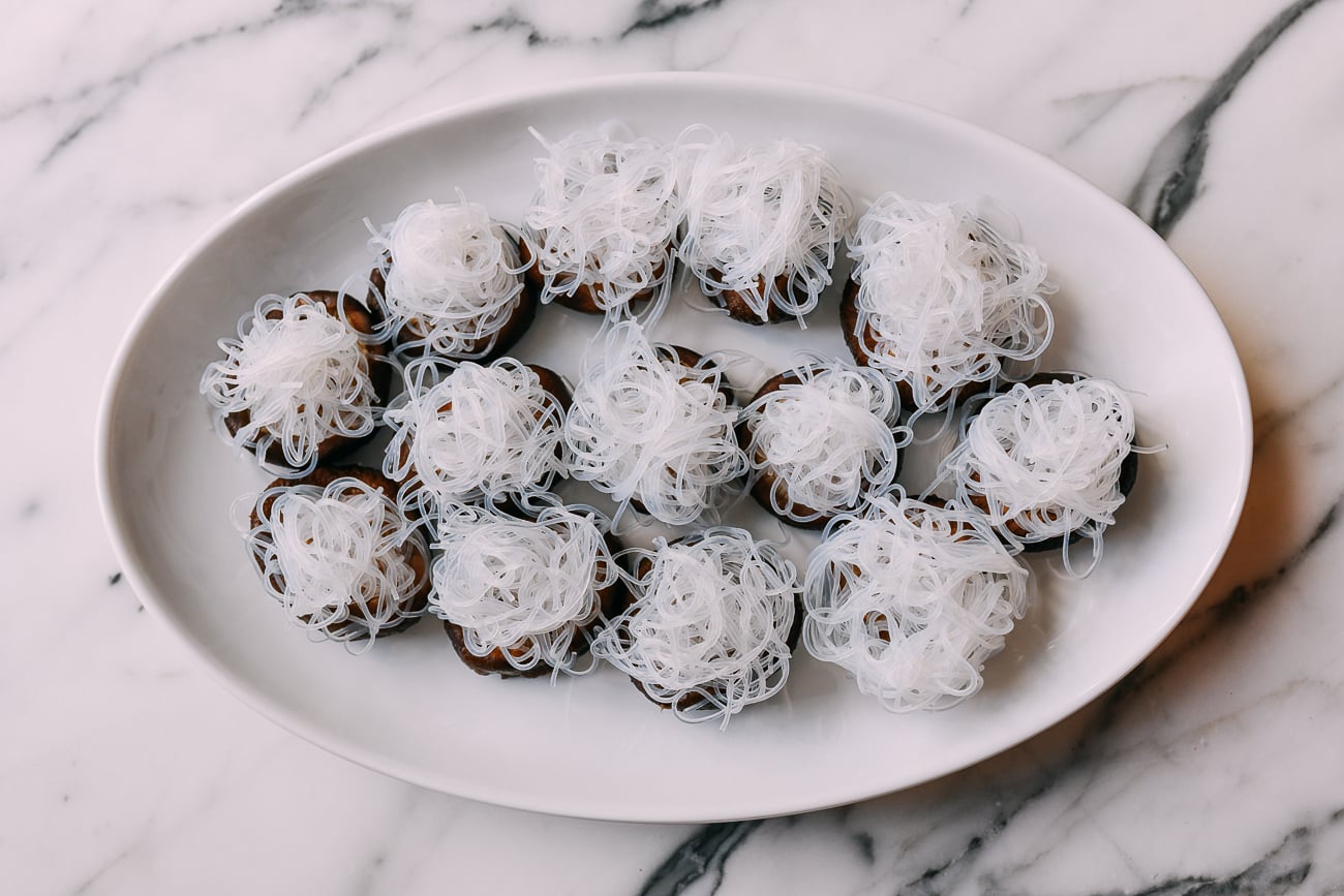 Shiitake mushrooms with noodles on top
