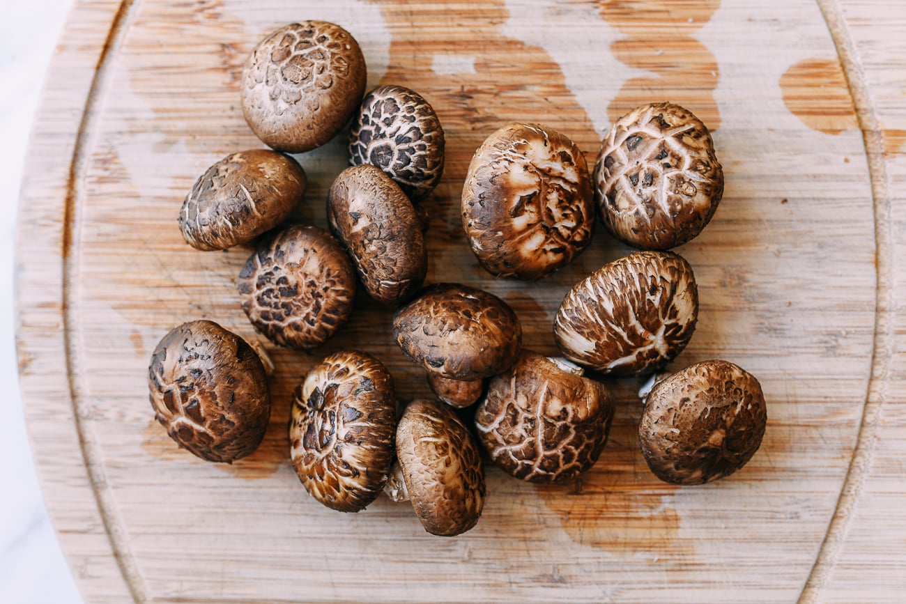 Fresh shiitake mushrooms on cutting board