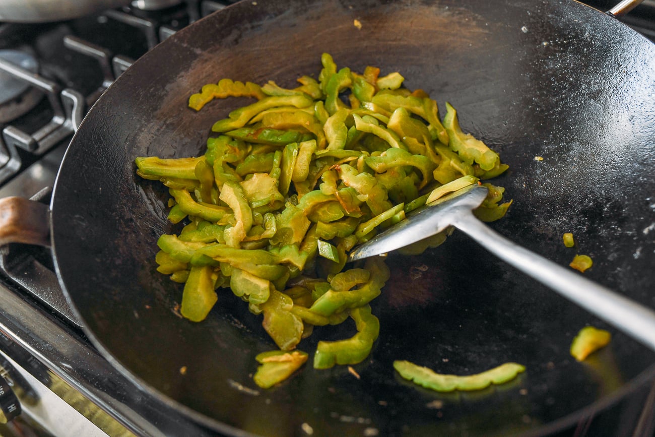 Stir-frying bitter melon in wok