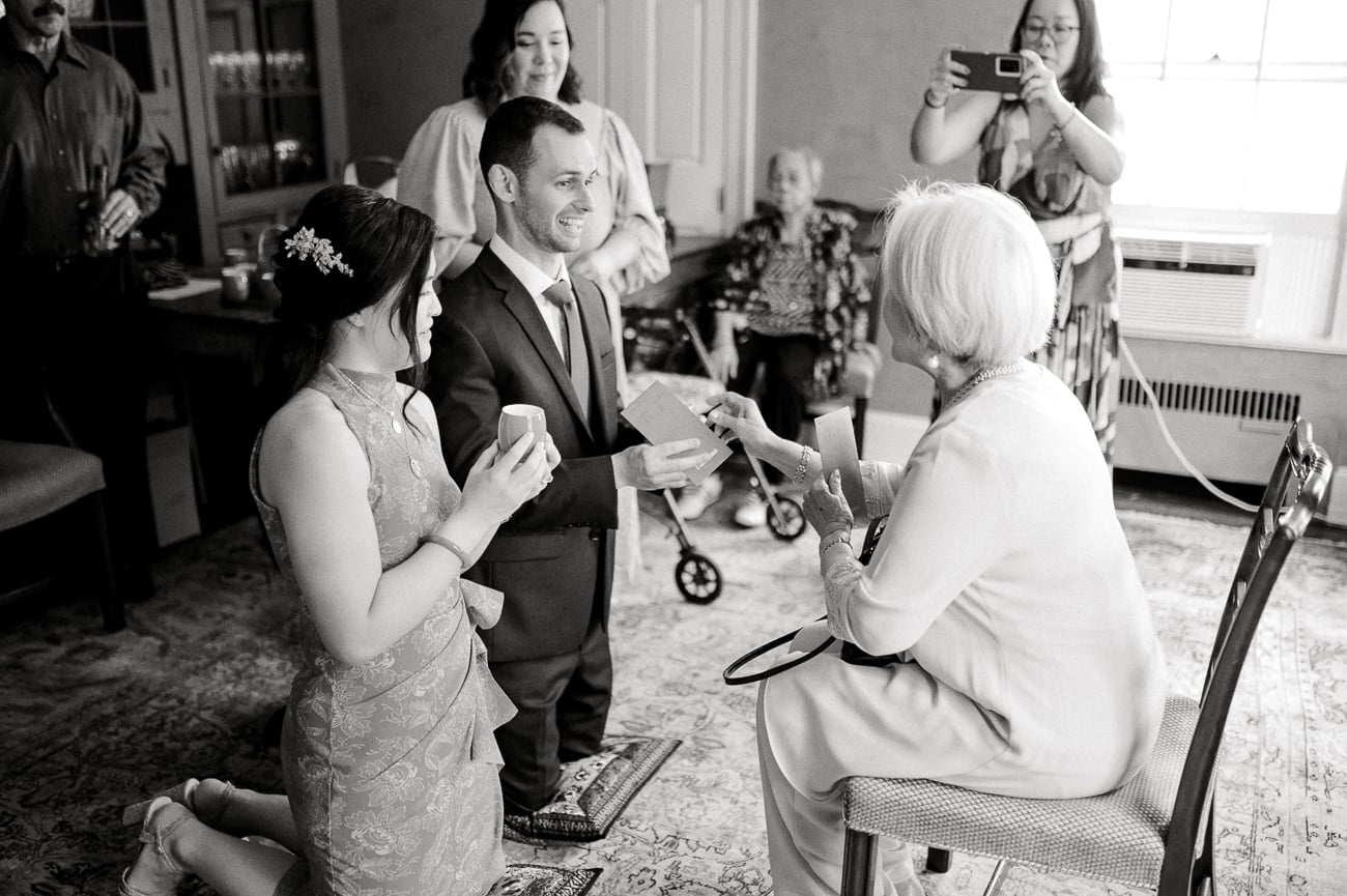 Sarah and Justin receiving a gift from Sarah's grandma