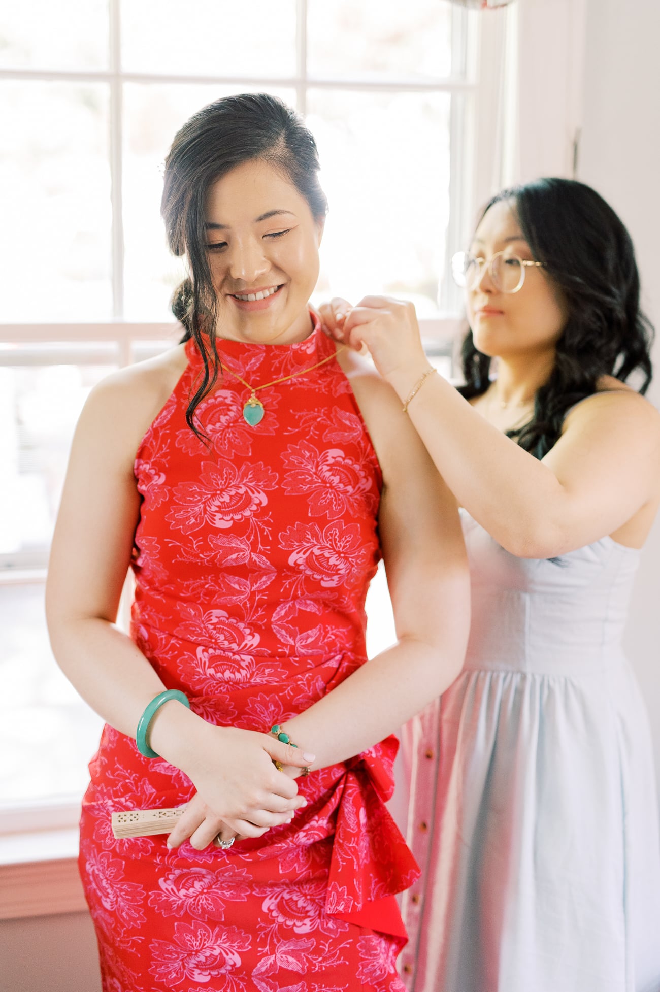 Kaitlin helping Sarah put on Jade necklace