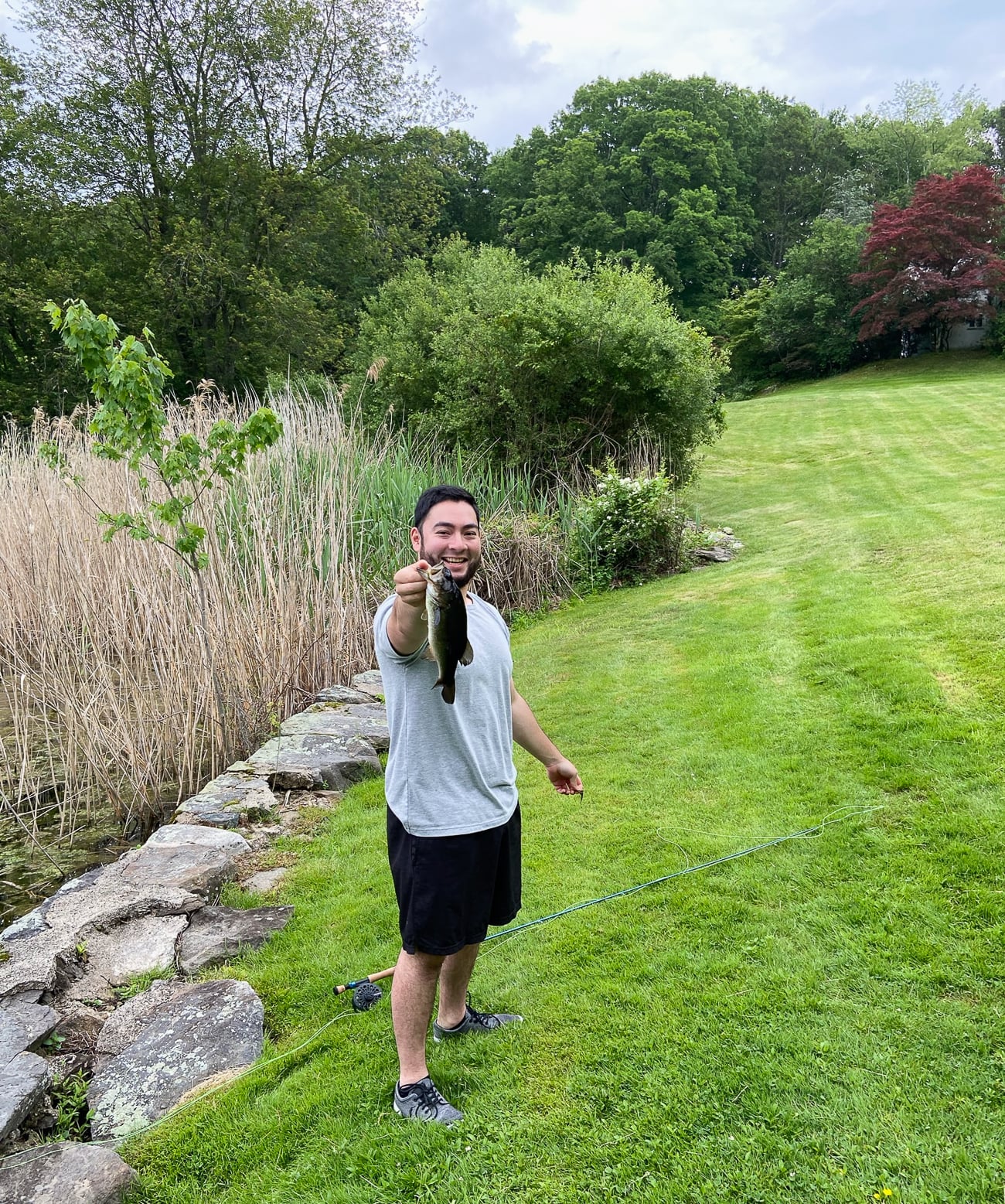 Chris holding up a bass