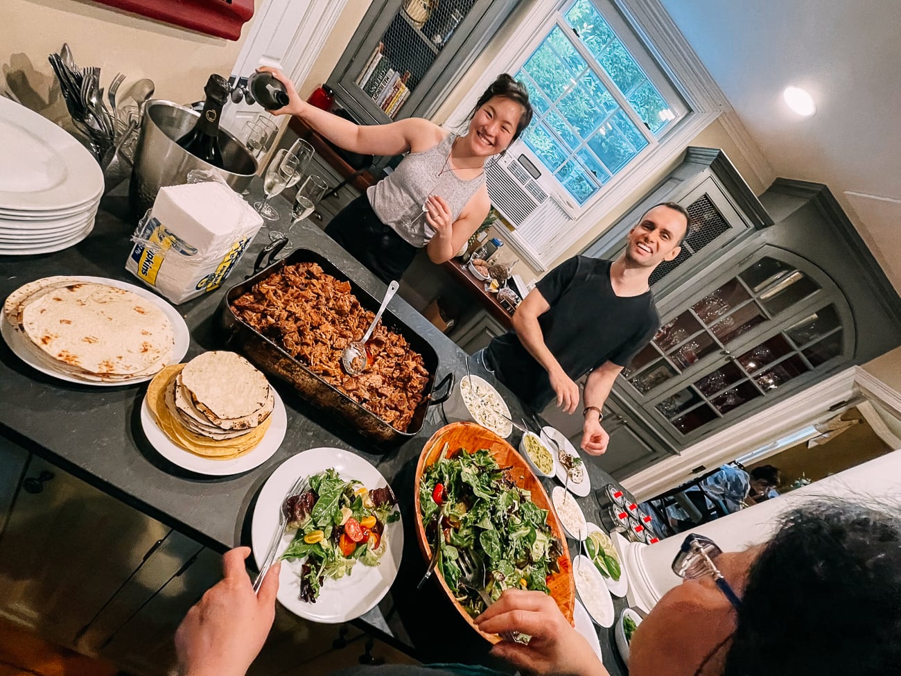 Sarha and Justin serving dinner