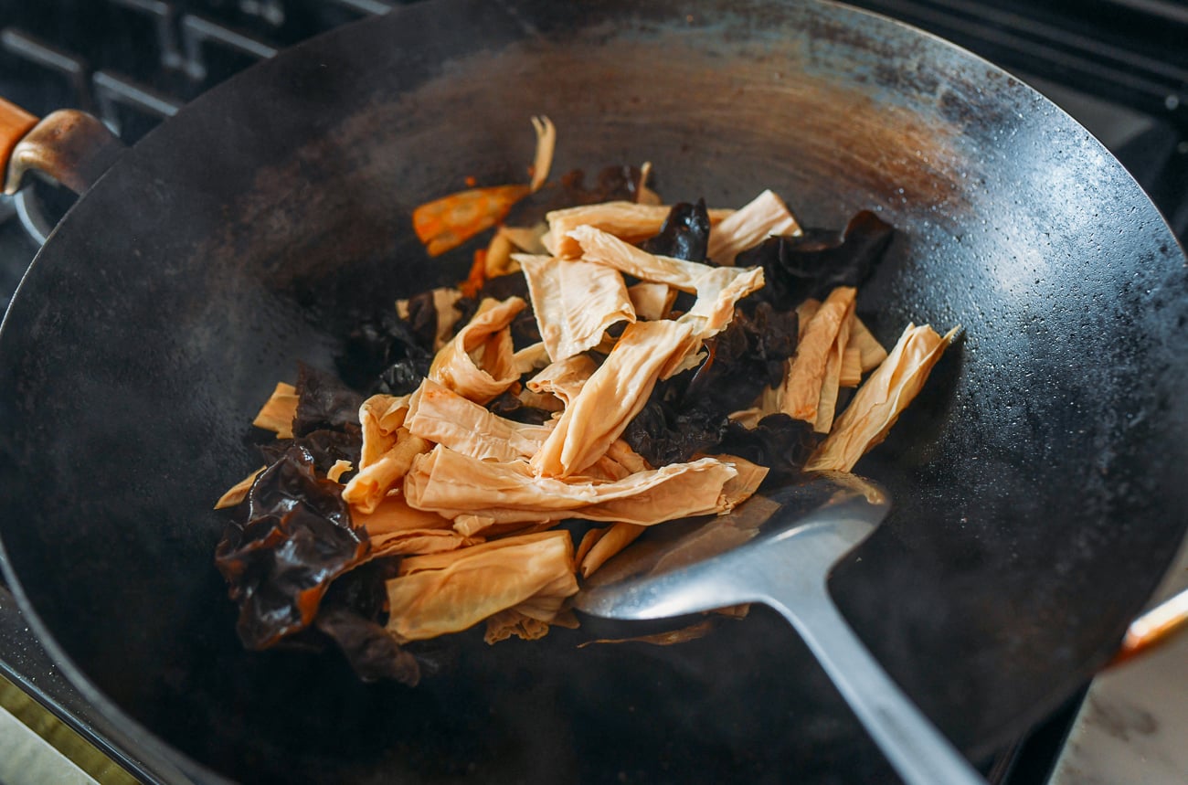Adding bean threads and wood ears to wok