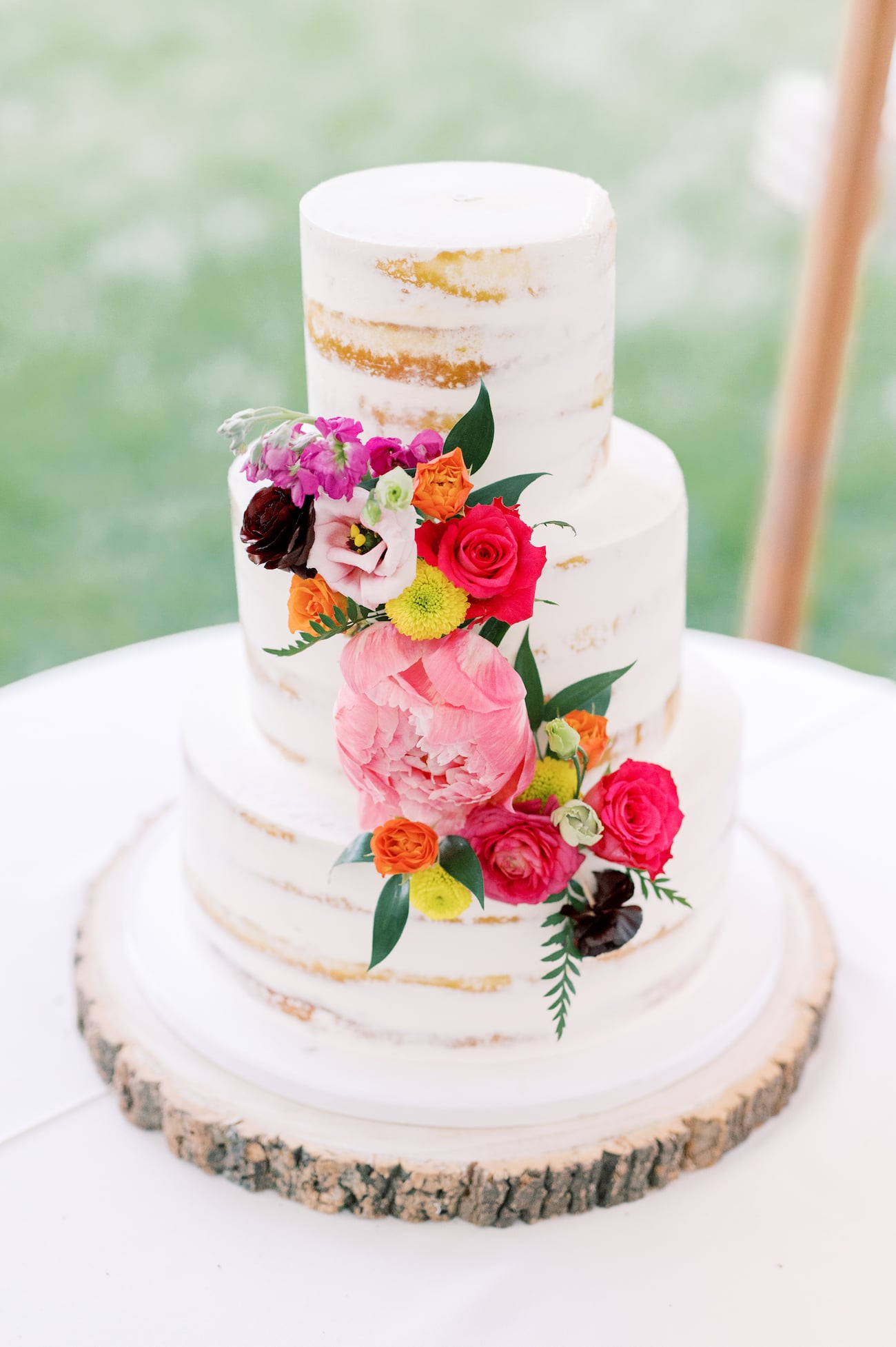 Naked wedding cake with floral decoration