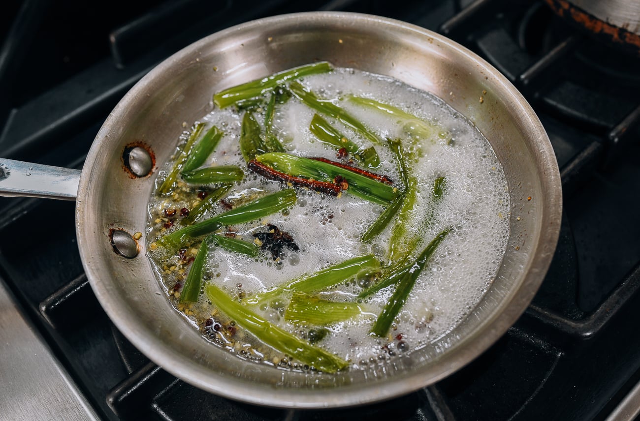 Infusing oil with scallions, garlic, and spices