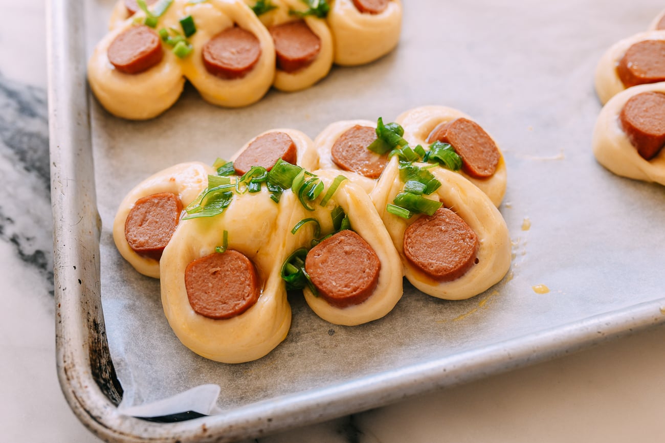 Egg wash and scallions on hot dog bun