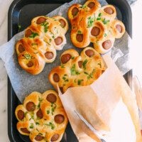 Chinese flower hot dog buns on tray