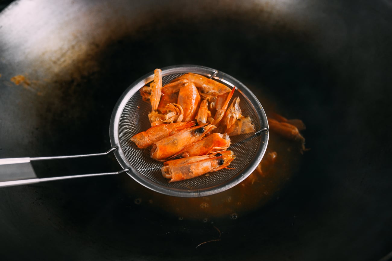 Removing shells from broth using a strainer