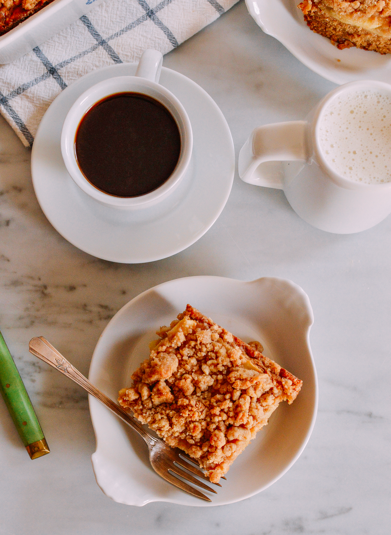 Apple cinnamon coffee cake with cup of coffee