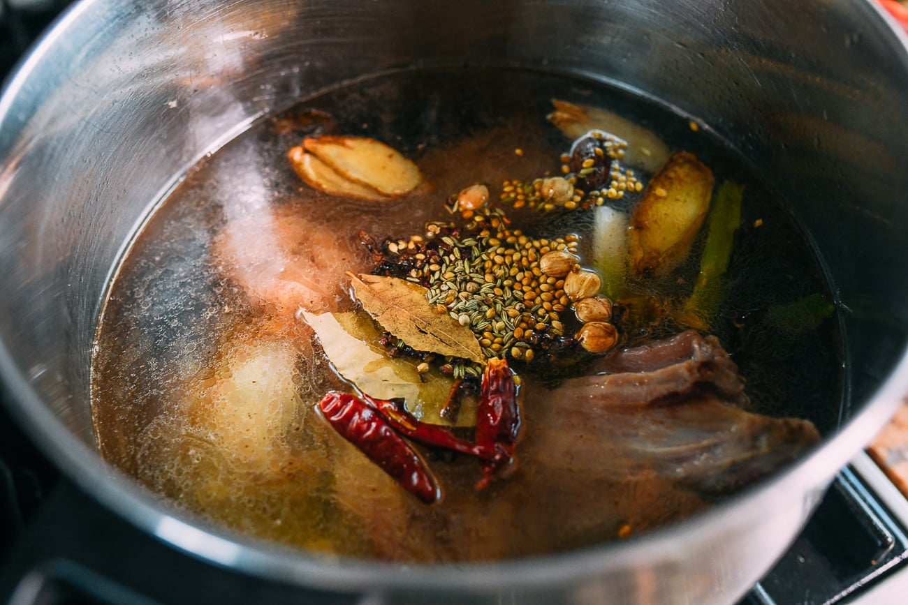 Spices in lamb broth mixture