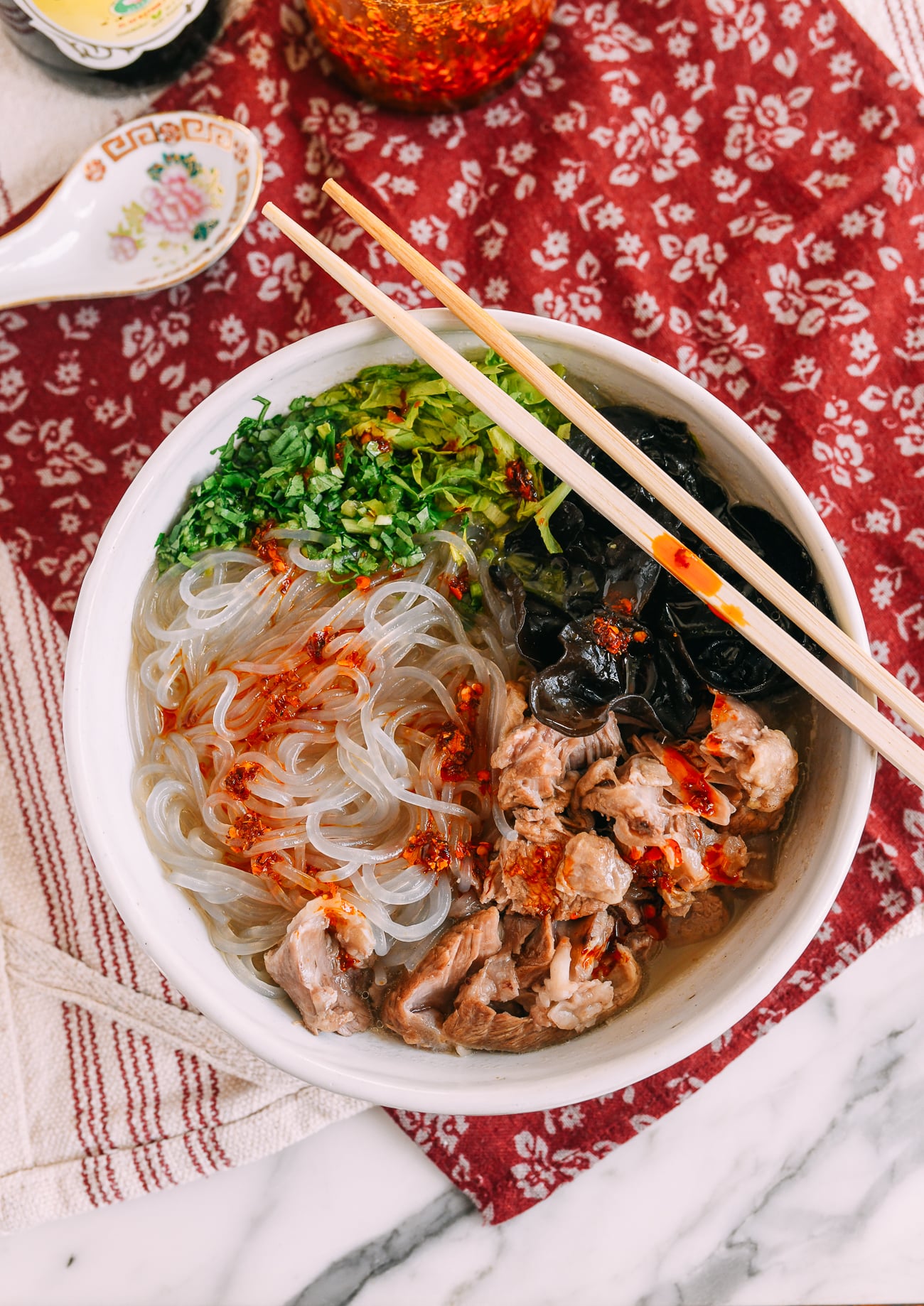 Bowl of Chinese Lamb Noodle Soup topped with chili oil