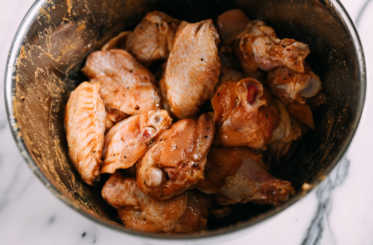 marinated wings in metal bowl