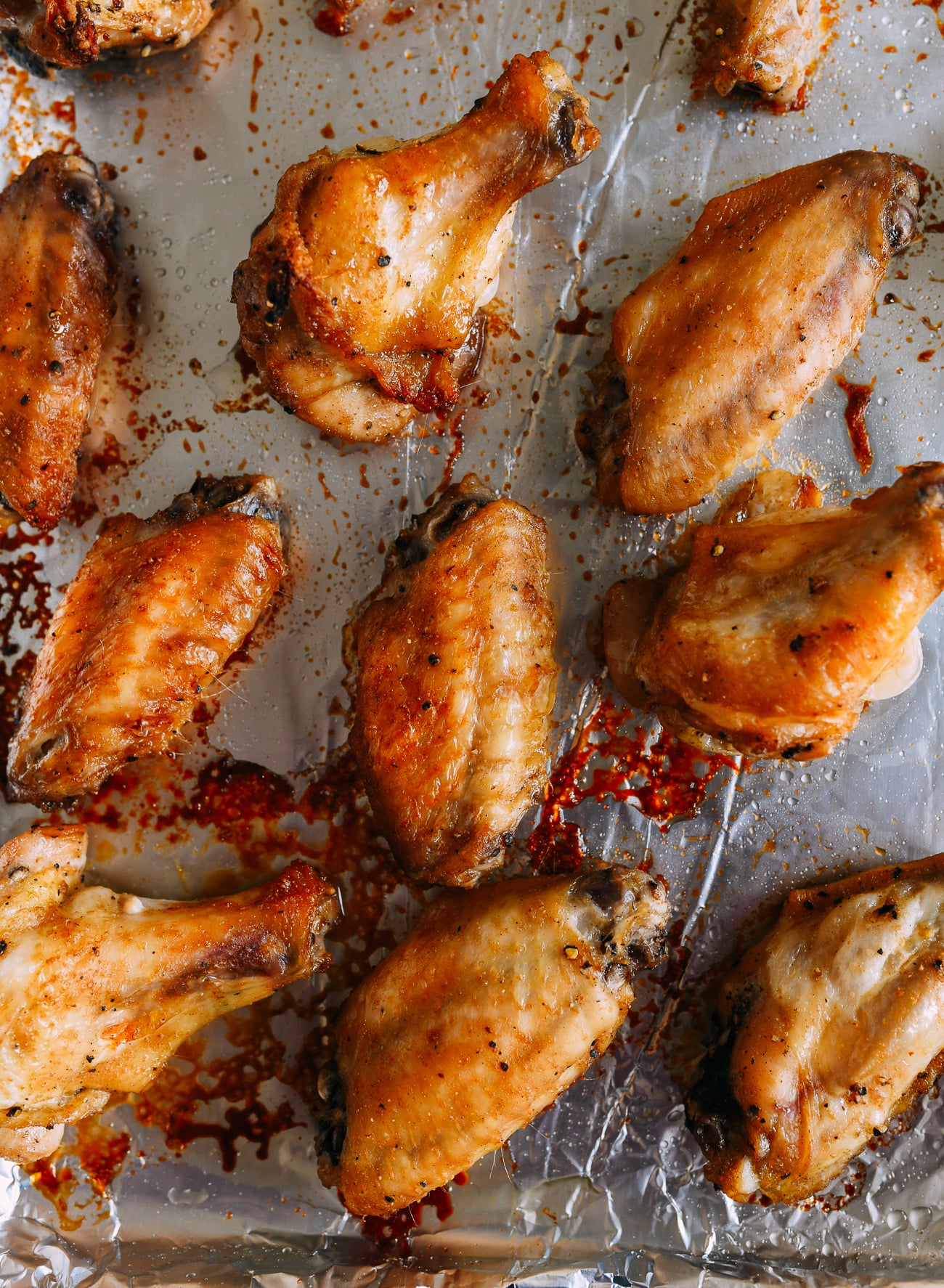 Baked chicken wings on foil-lined sheet pan