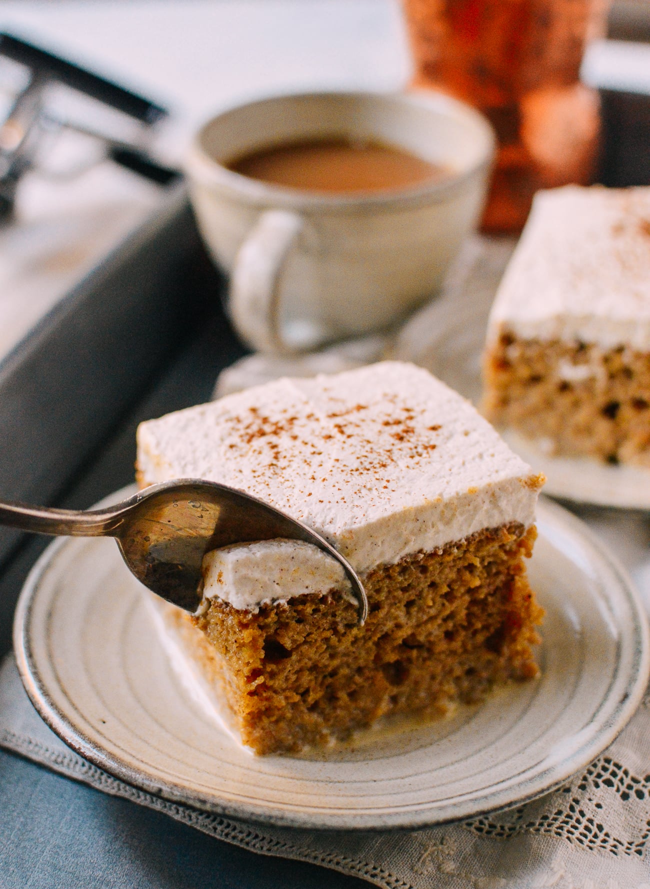 Digging into pumpkin tres leches cake with a spoon