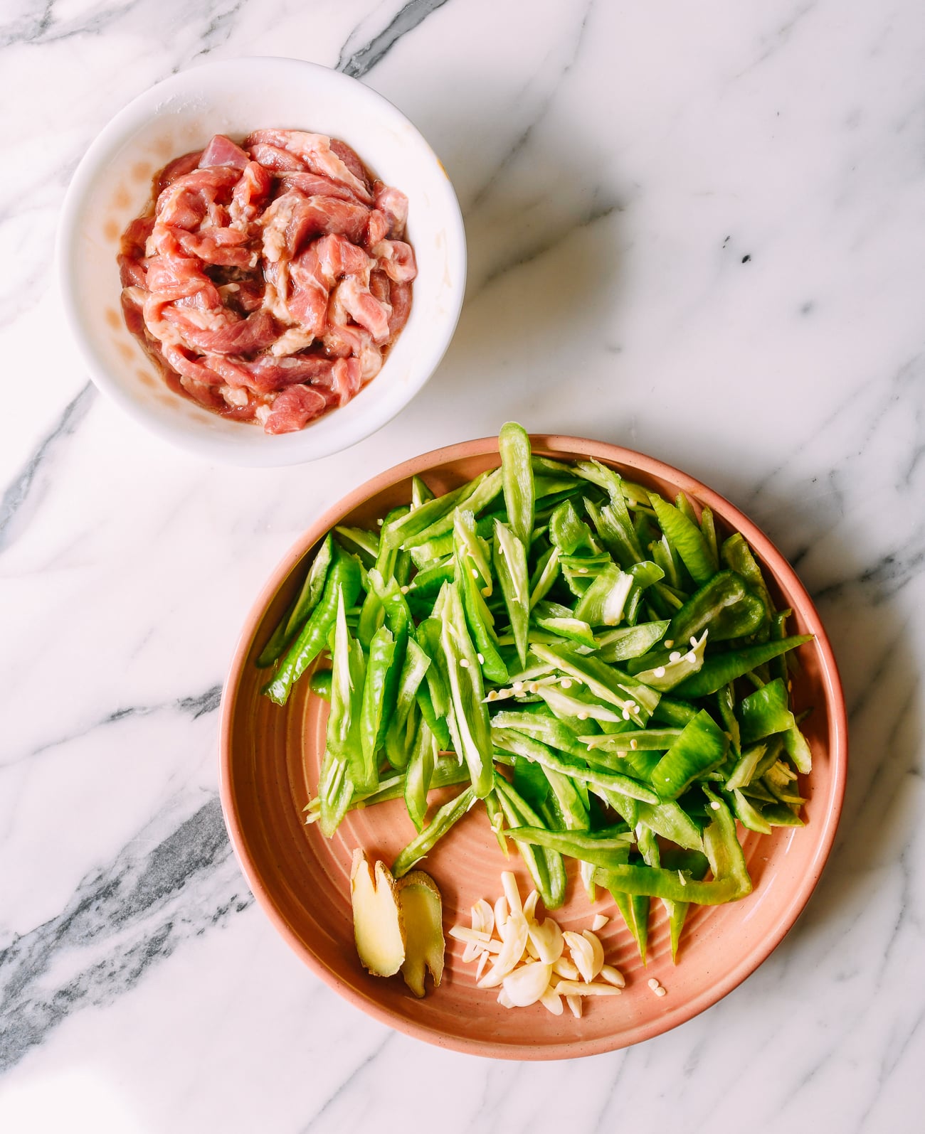 Marinated pork, sliced peppers, ginger, and garlic