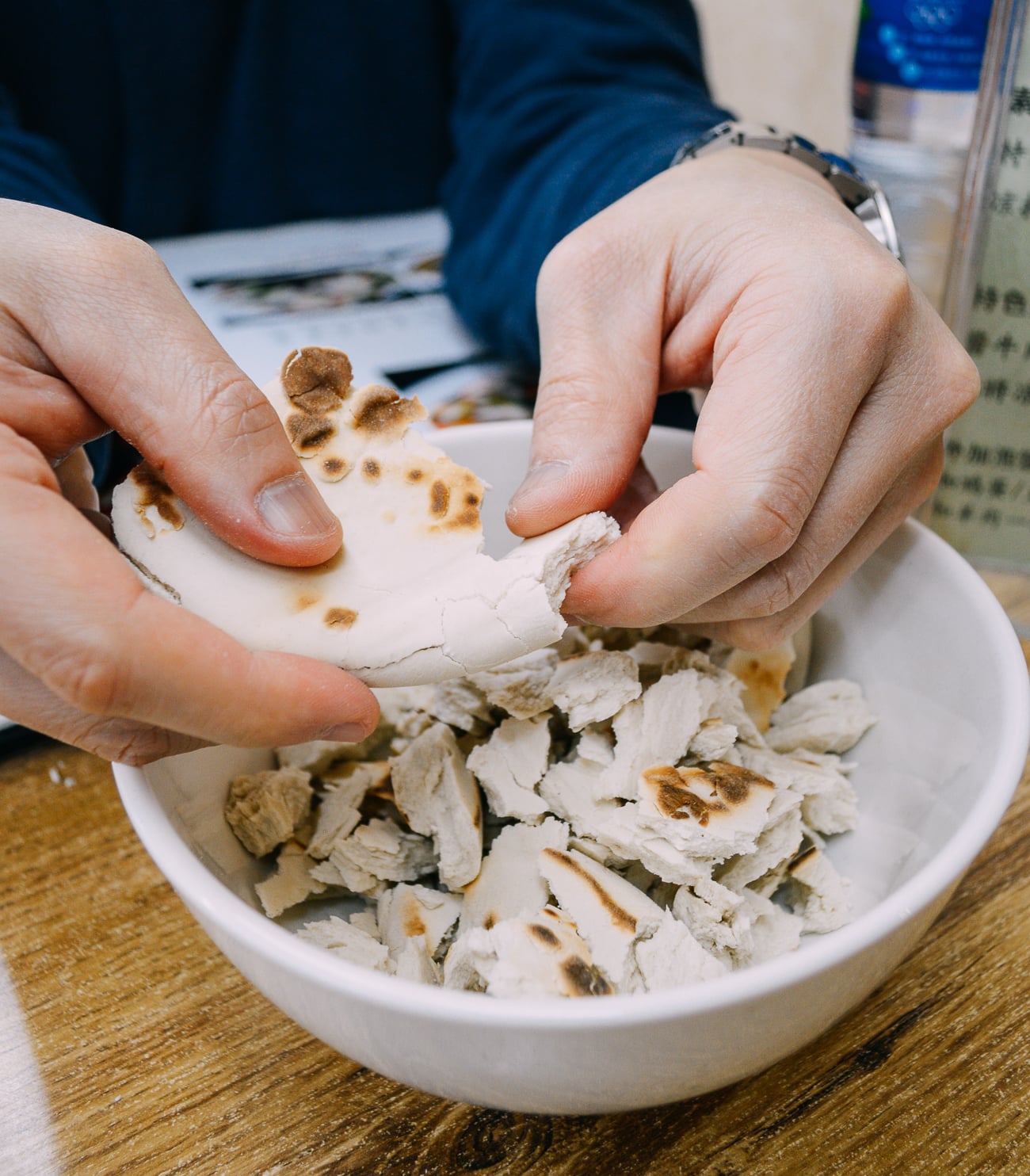 Tearing bits of bread for yangrou paomo