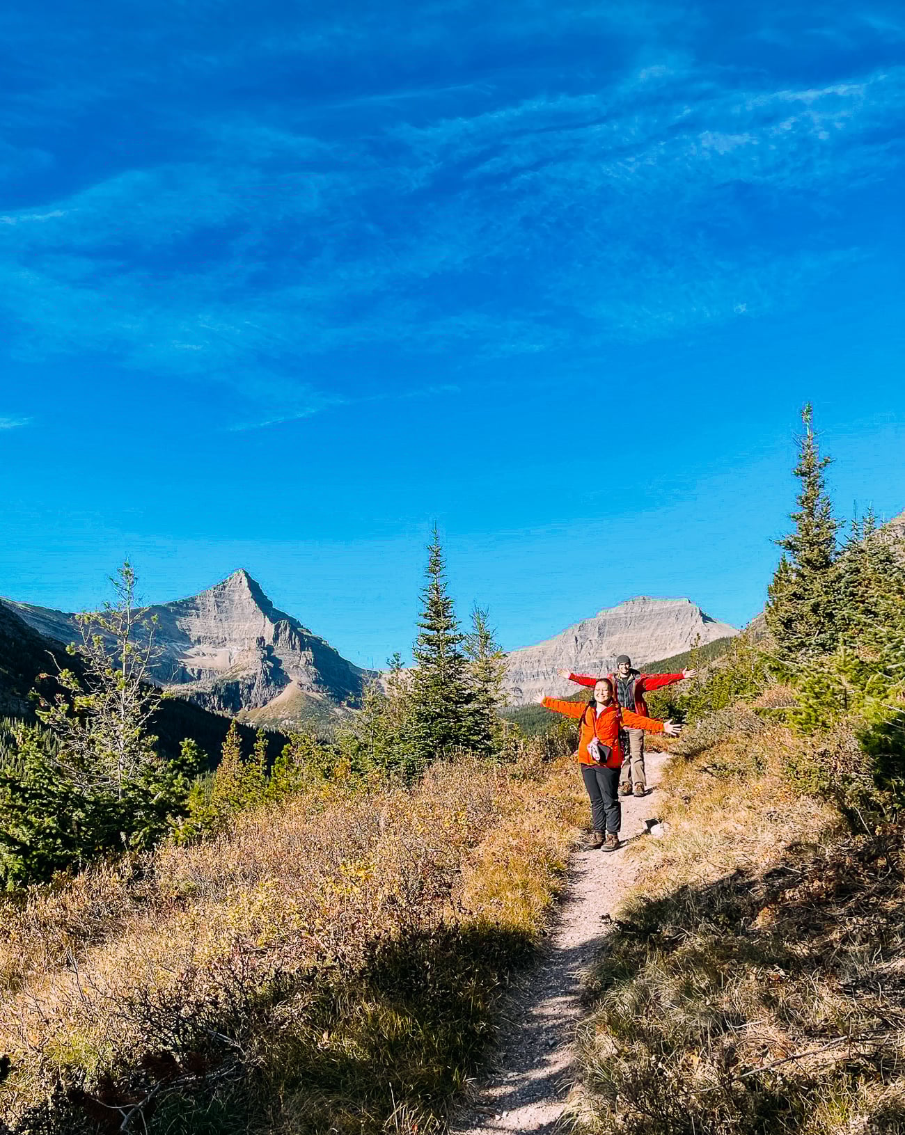 Justin and Kaitlin hiking through valley on Pitamakan Pass/Old Man Lake Trail