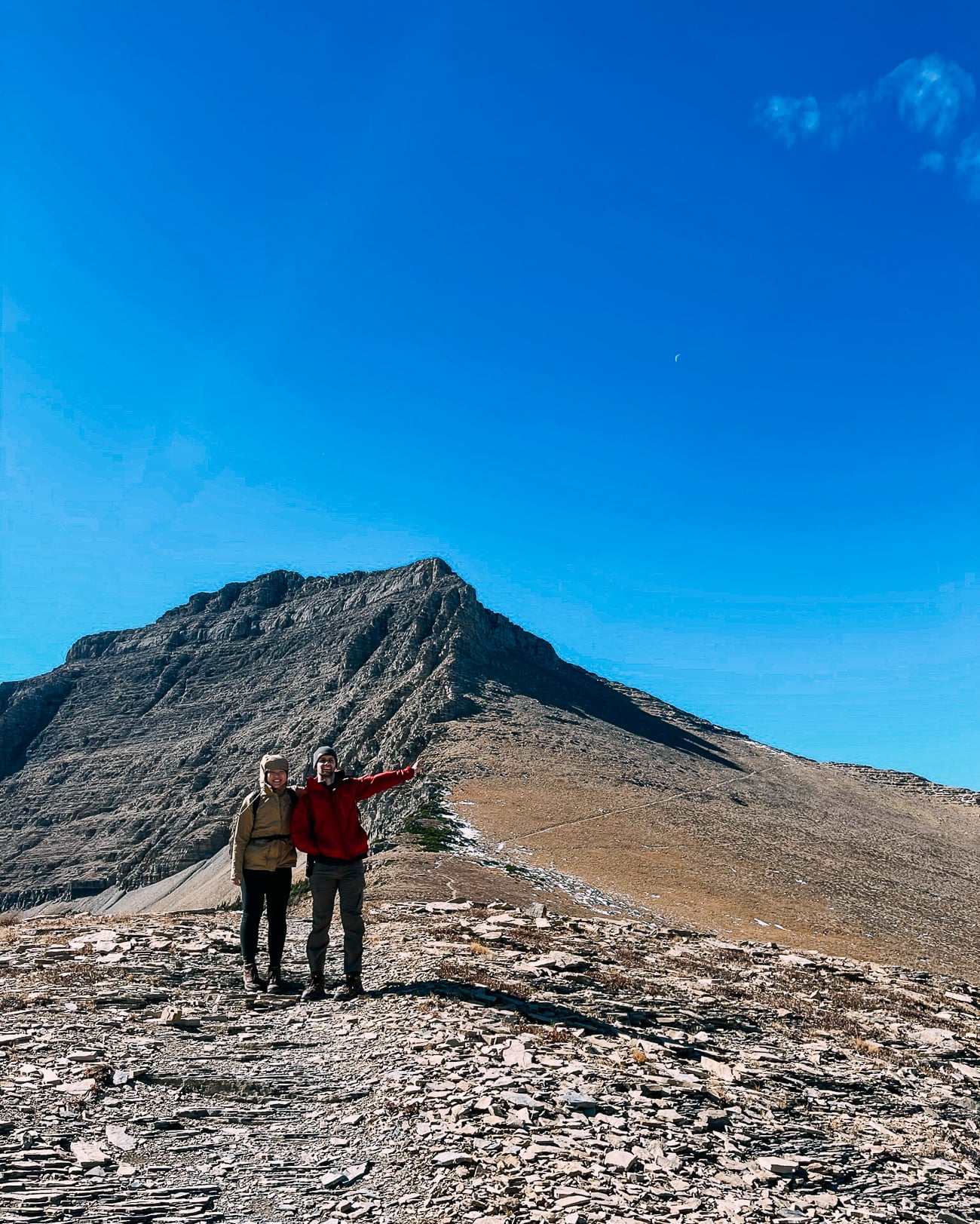 Sarah and Justin pointing to Pitamakan Pass