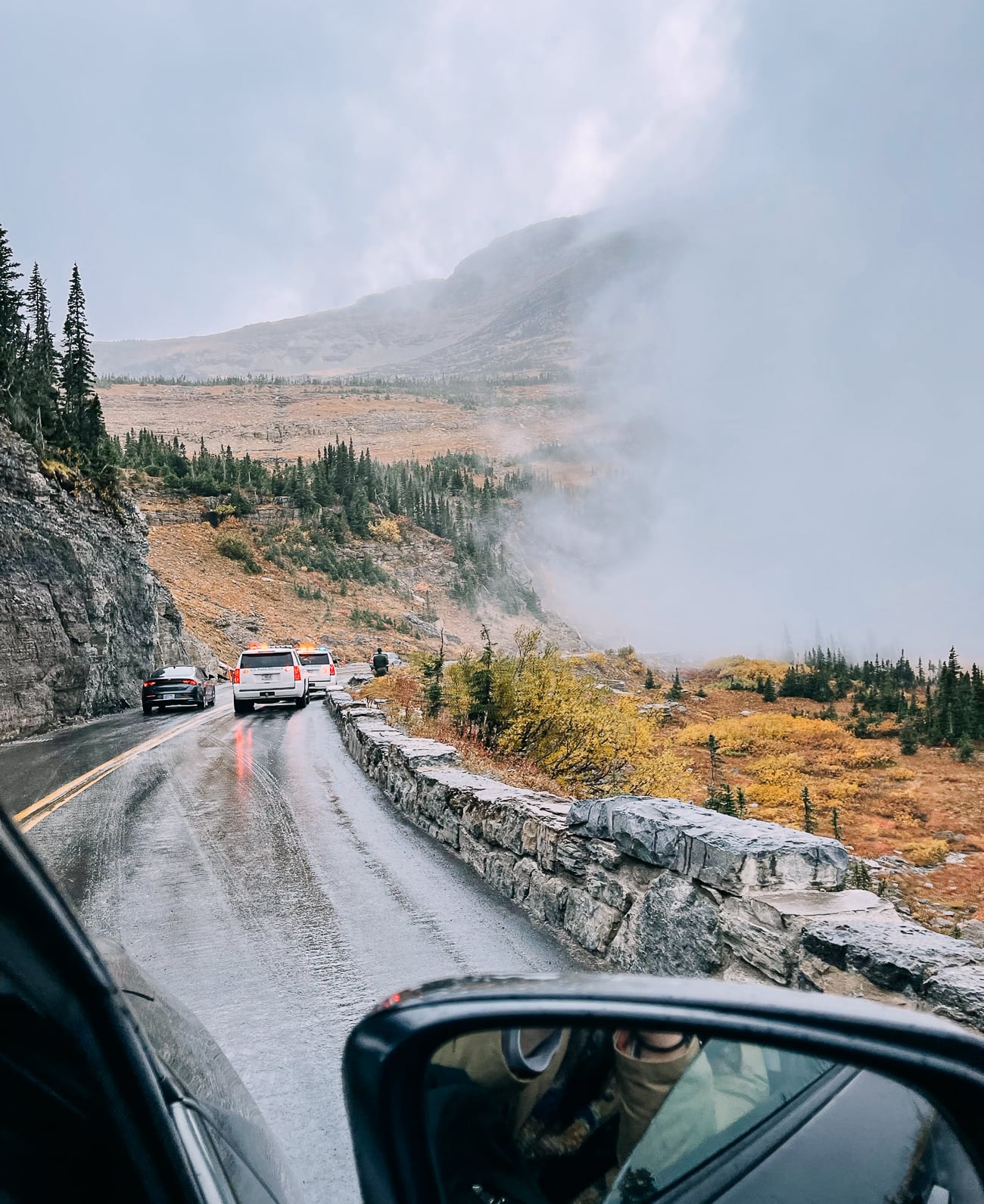 NPS trucks on side of going to the sun road at Logan Pass