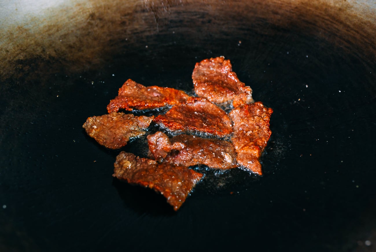 Browned beef slices in wok