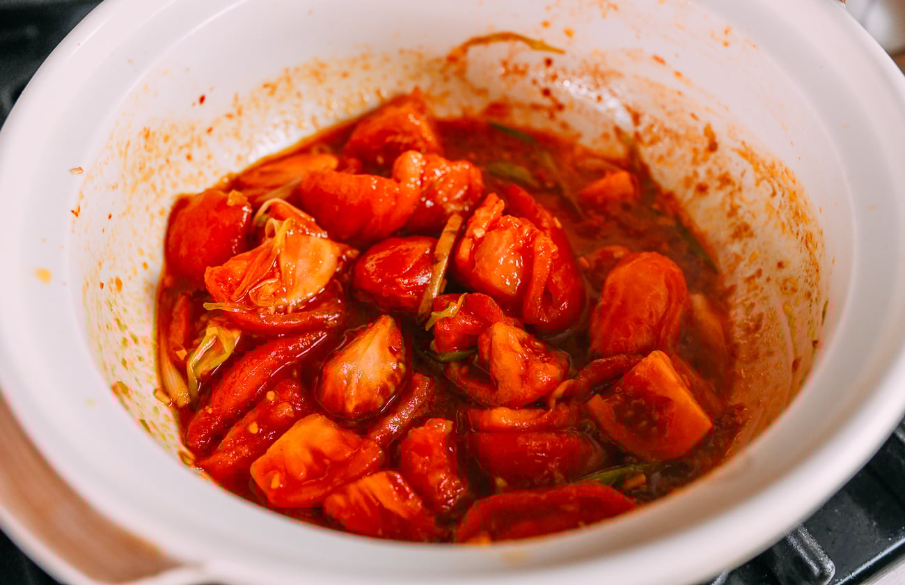 Tomato chunks added to pot