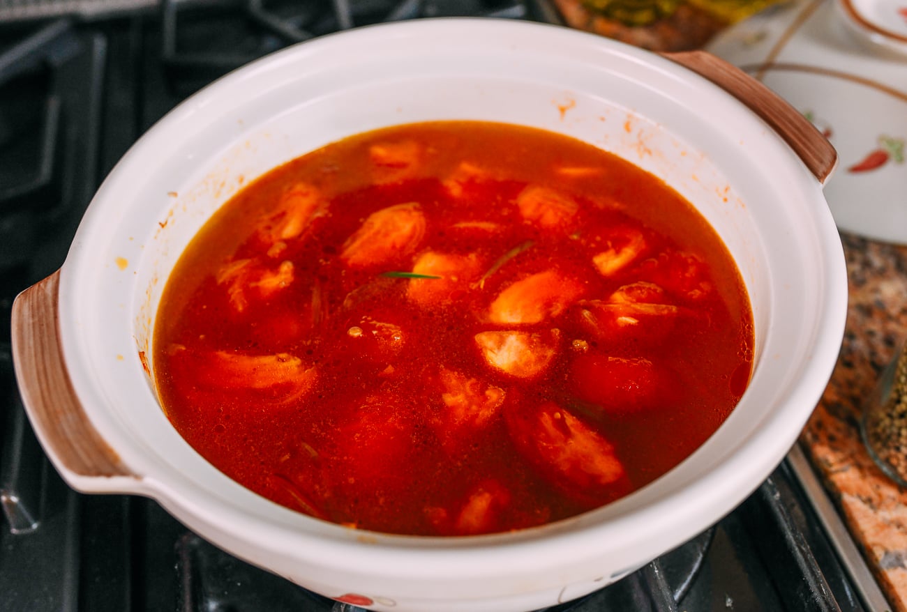Chicken stock and water added to pot