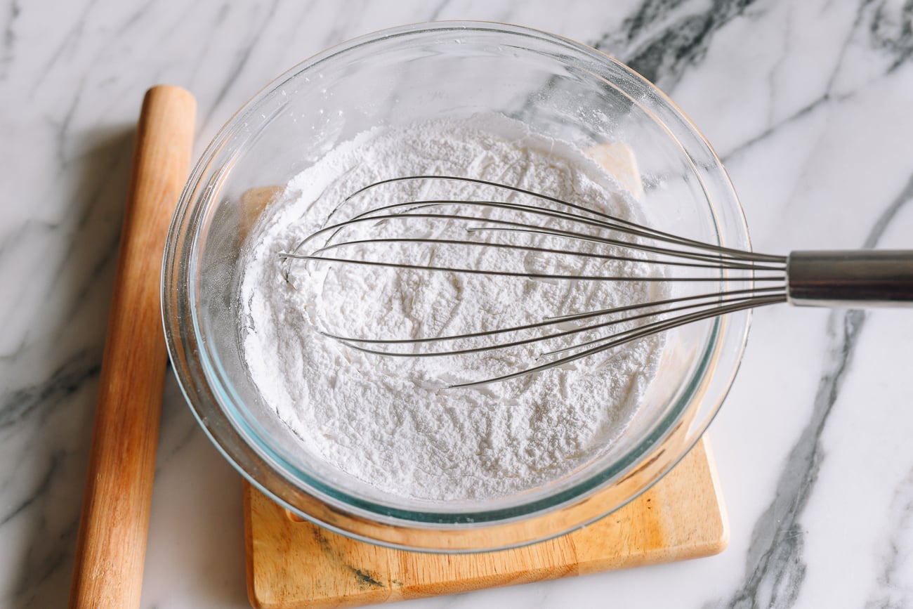 Whisking together starches in glass bowl