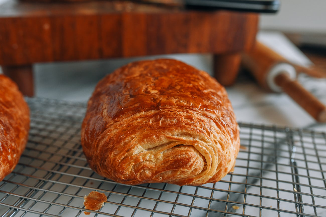 Ham and cheese croissant on a cooling rack