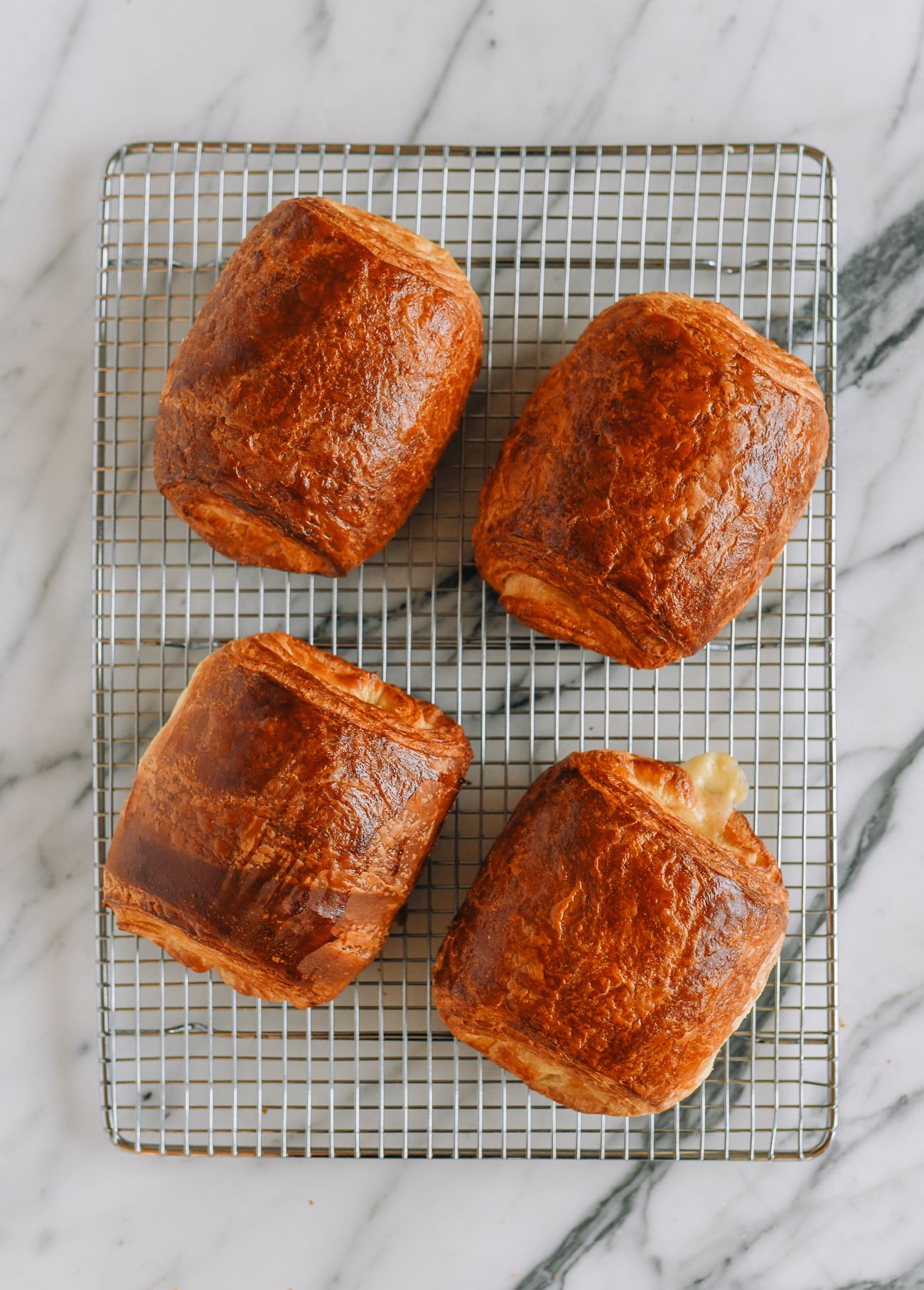 ham and cheese croissants on baking sheet