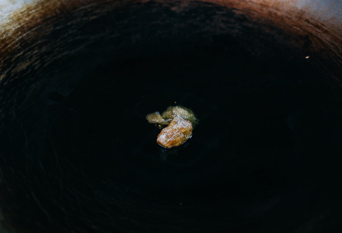 melting rock sugar in wok