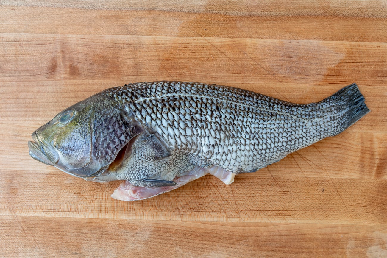 sea bass on cutting board