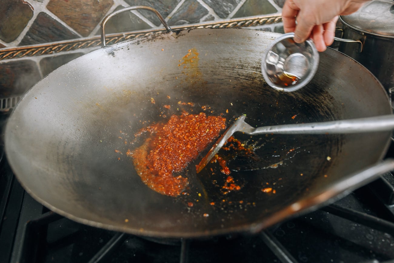 Adding Shaoxing wine to chili garlic sauce mixture