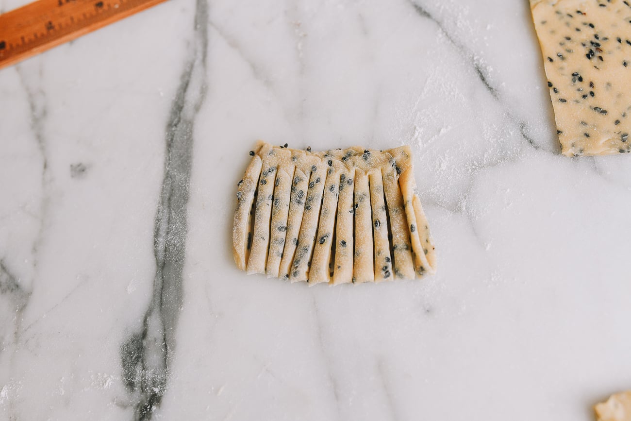 Cutting many slits into dough