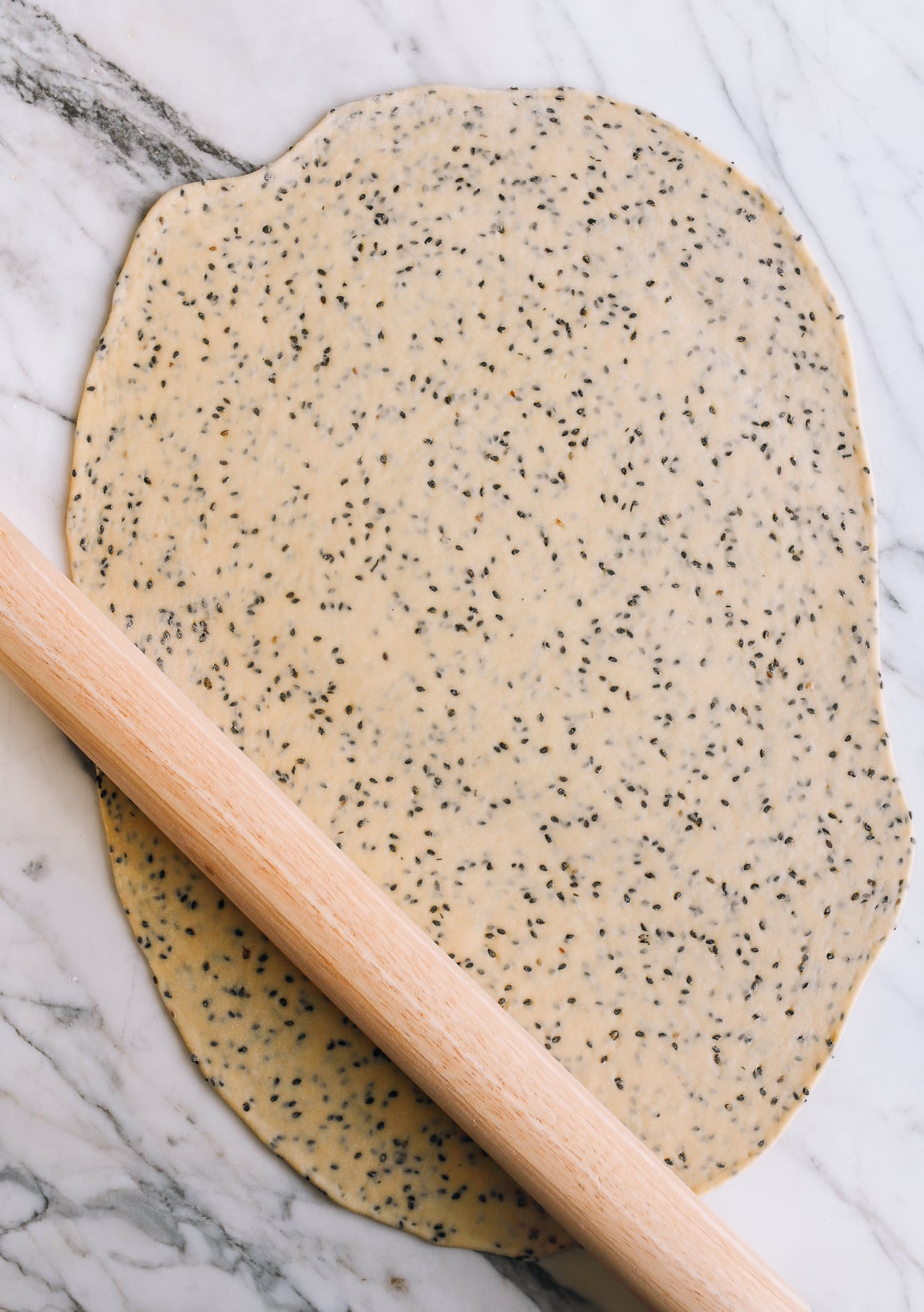 Rolled sesame dough in rough rectangle shape