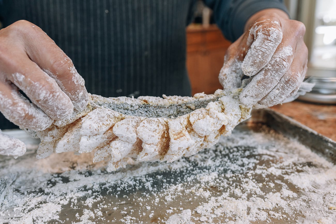 grabbing fish fillets so the meat is facing out