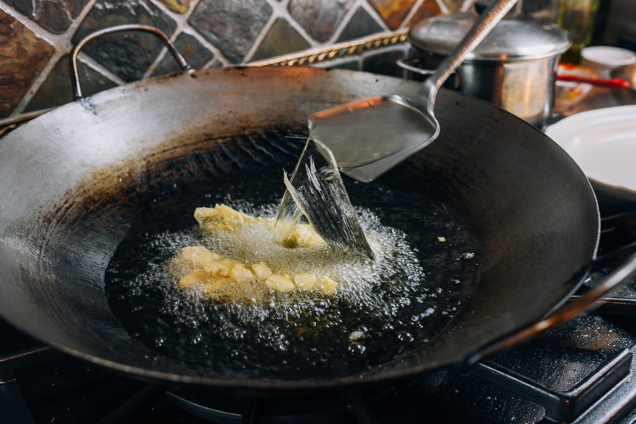Frying chinese squirrel fish in wok