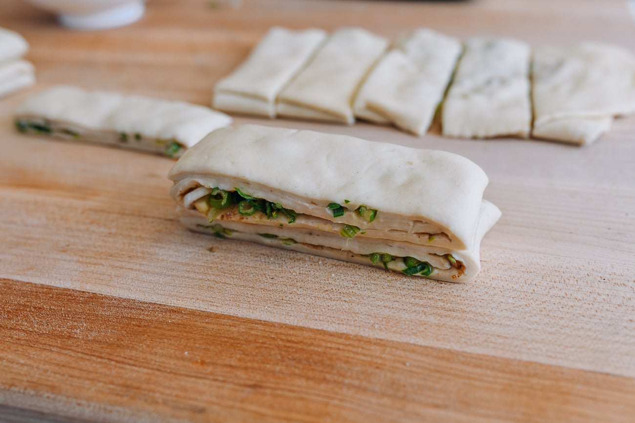 Two trips of cut dough stacked on top of one another