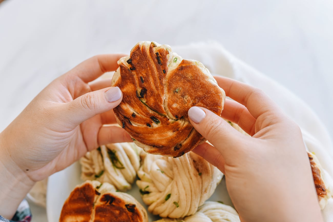 holding hua juan in hands