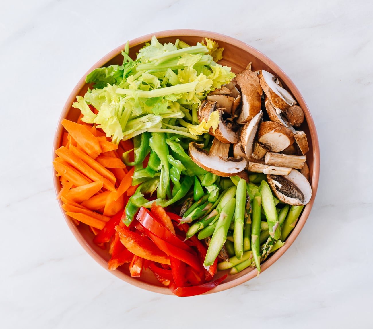 Mixed vegetables prepared for stir-fry on plate