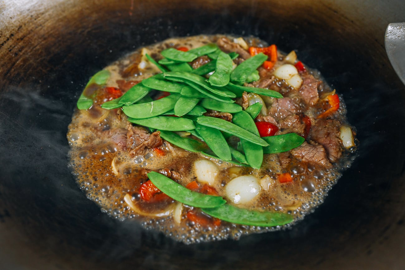 Adding snow peas to stir-fry
