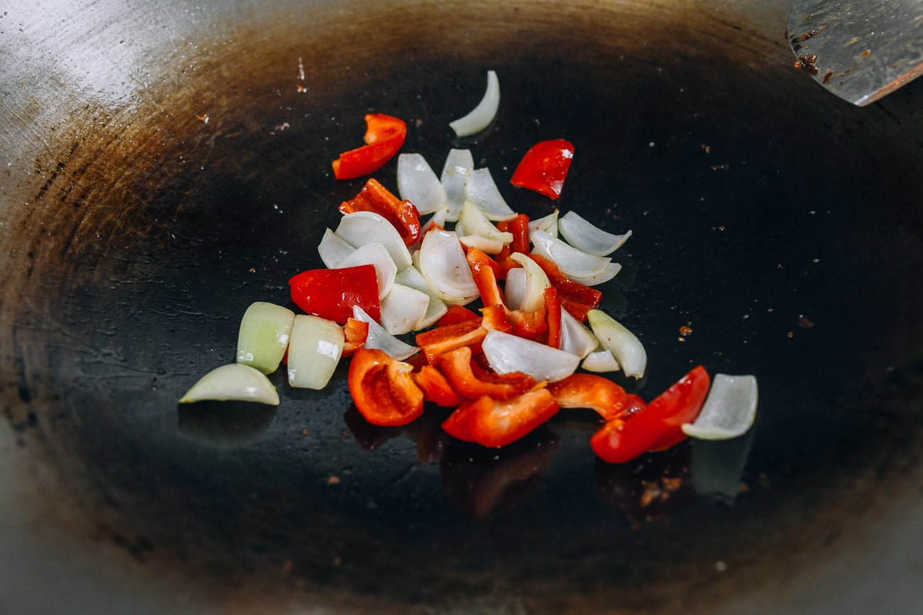 Bell pepper and onions in wok