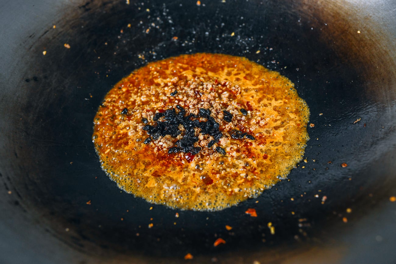 fermented black beans added to mapo sauce mixture