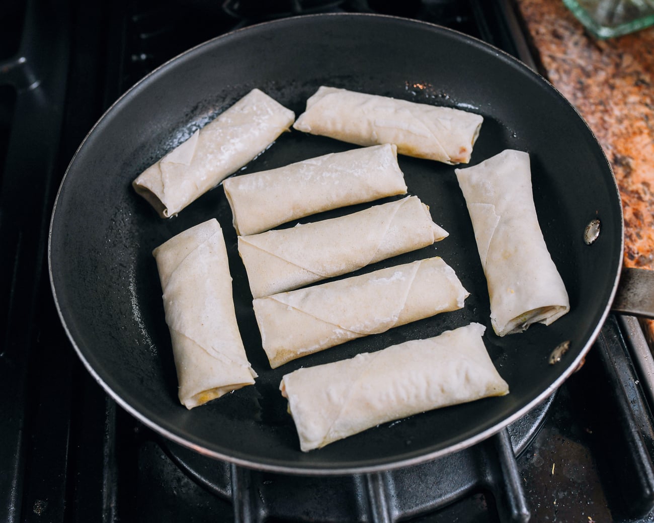 spring rolls in nonstick pan