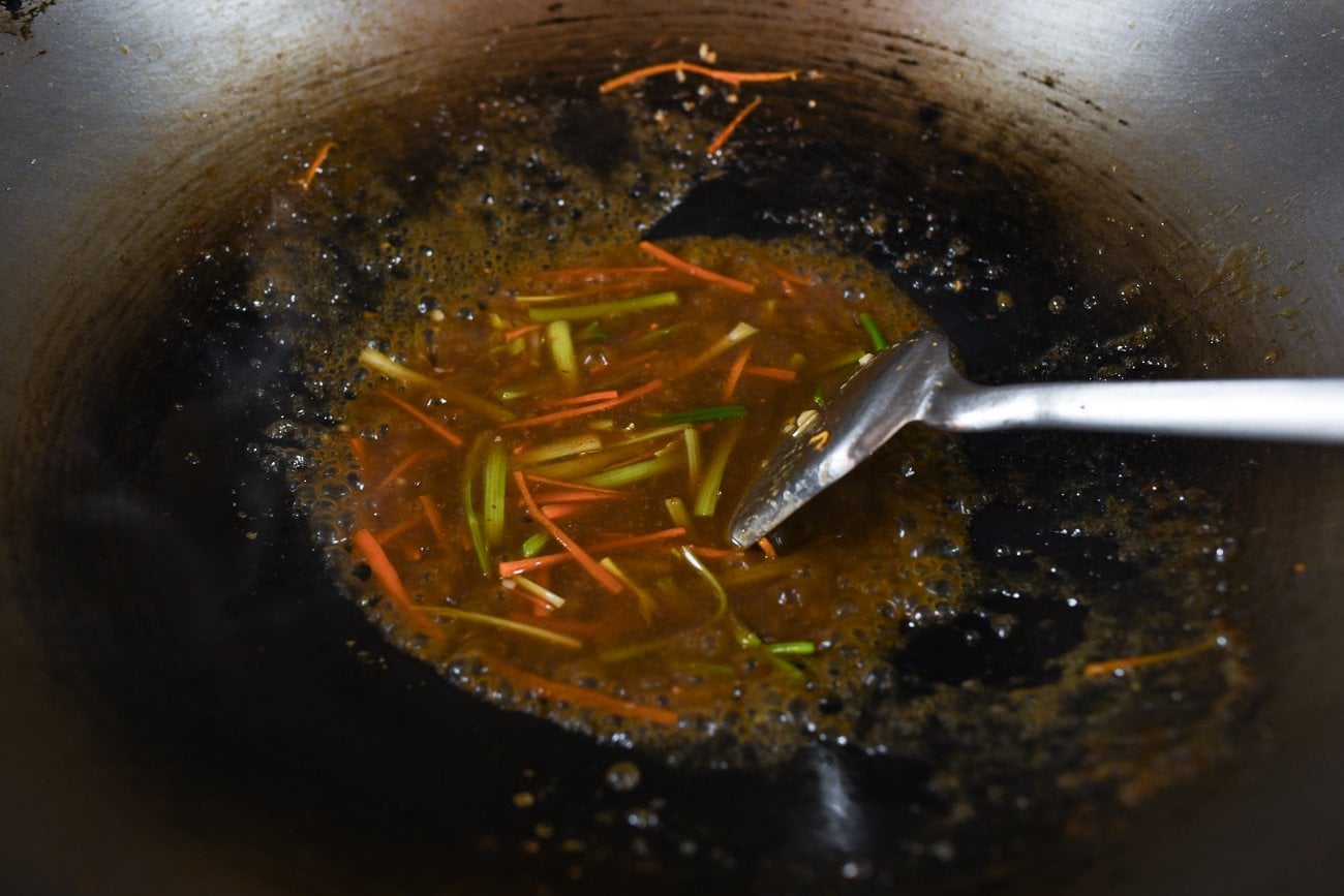 adding sauce mixture to celery and carrot